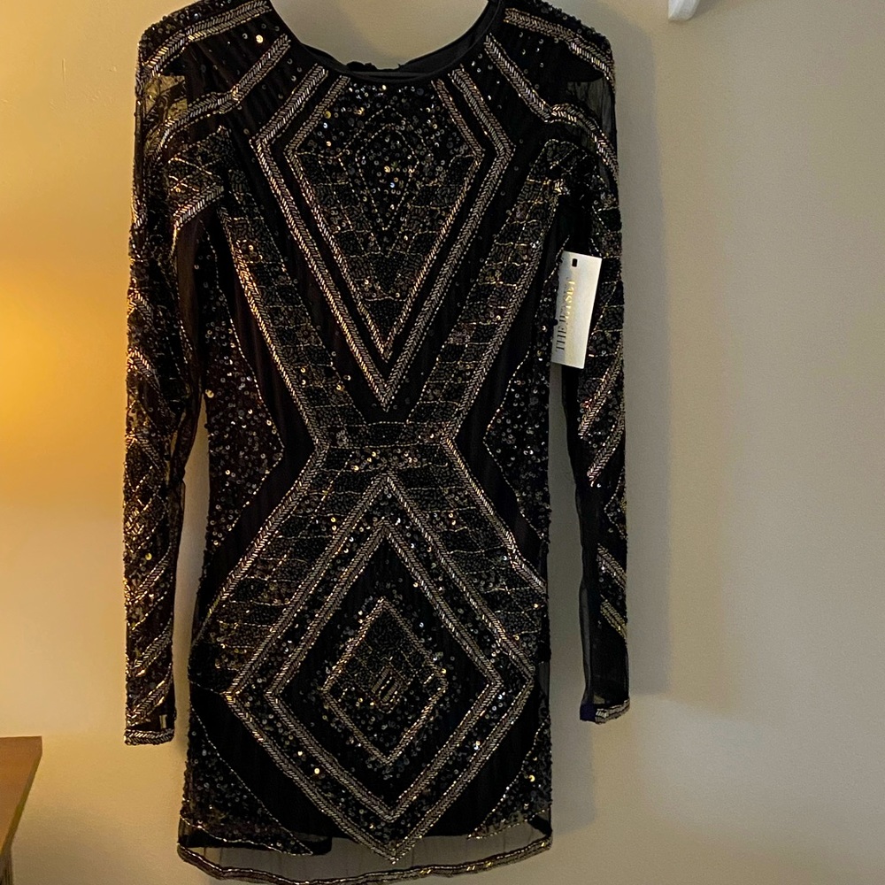 Stunning black/gold dress for holidays. Lots of sparkly sequins.